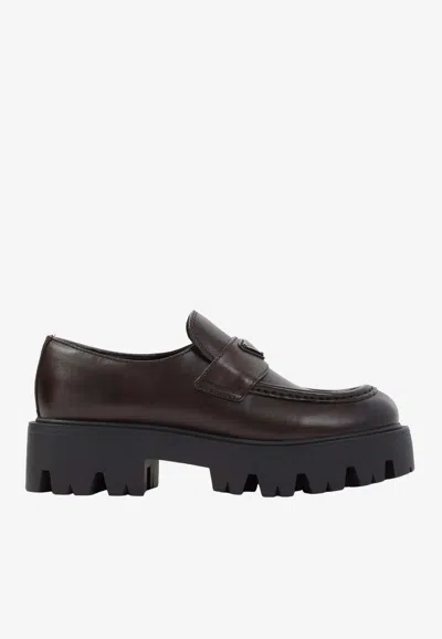 Prada Stride Leather Penny Loafers In Brown