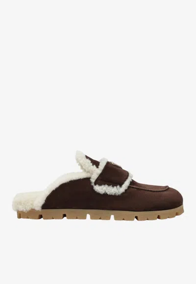 PRADA SUEDE AND SHEARLING CLOGS
