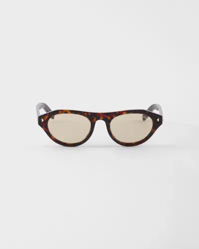 Prada Sunglasses With The Iconic Metal Plaque