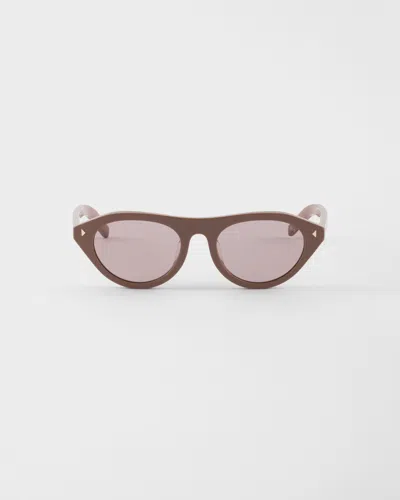 Prada Sunglasses With The Iconic Metal Plaque