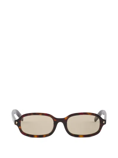 Prada Sunglasses With The Iconic Metal Plaque In Pattern