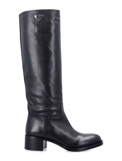 Prada Tall Leather Riding Boots With Enameled Triangle Logo & Low Block Heel In Nero