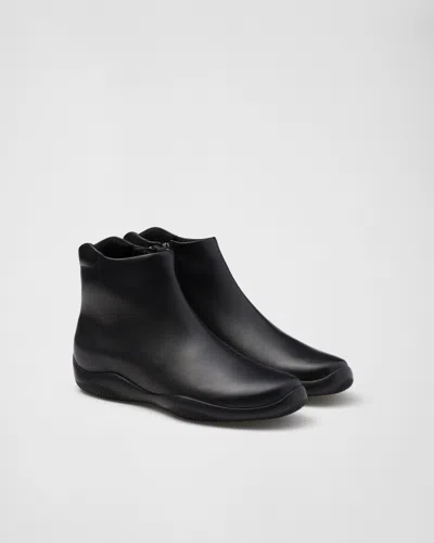 PRADA TOBLACH LEATHER ANKLE BOOTS