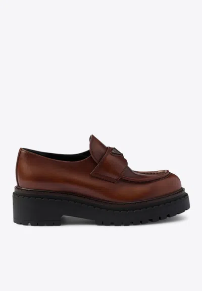 Prada Triangle Logo Brushed Leather Loafers In Cognac