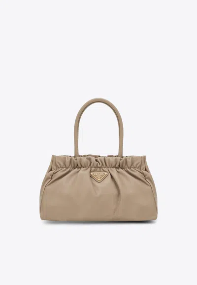 Prada Triangle Logo Leather Drawstring Handbag In Sand