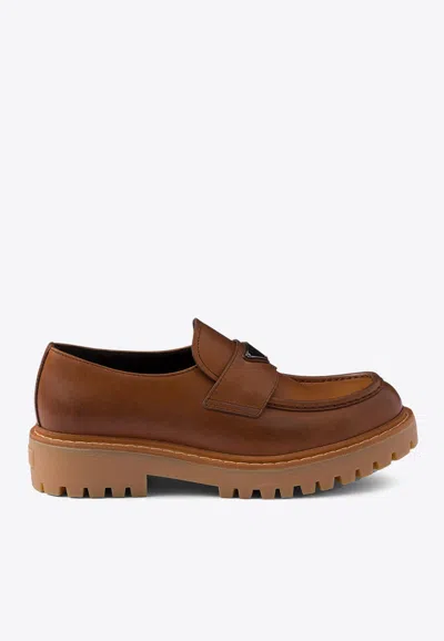 Prada Triangle Logo Leather Loafers In Brown