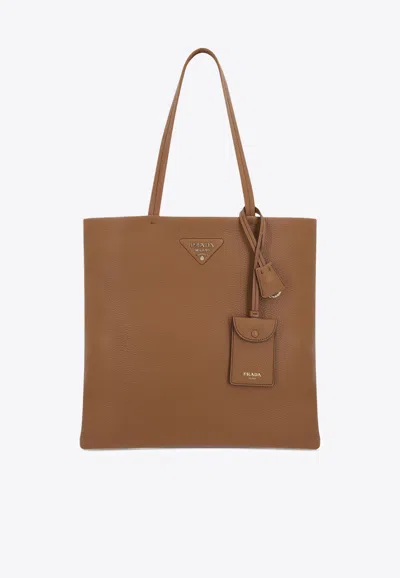 Prada Triangle Logo Leather Tote Bag In Brown