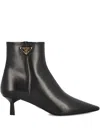 Prada Triangle-logo Pointed-toe Boots In Black