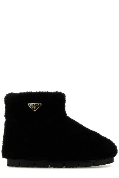 PRADA PRADA TRIANGLE LOGO SHEARLING ANKLE BOOTS