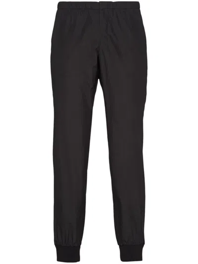 PRADA PRADA TRIANGLE-LOGO SILK TRACK PANTS