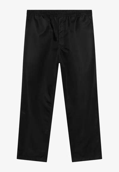 Prada Triangle-logo Elasticated-waistband Trousers In Black