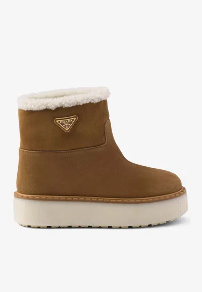 Prada Triangle Logo Suede Snow Boots In Brown
