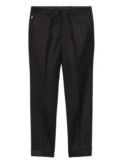 PRADA TRIANGLE-LOGO WOOL TROUSERS