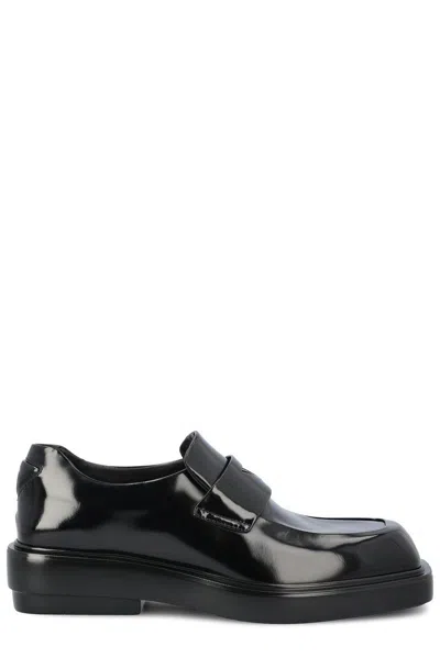 Prada Triangle-patch Slip-on Loafers In Nero