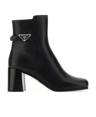 Prada Triangle-plaque Ankle Boots In Black