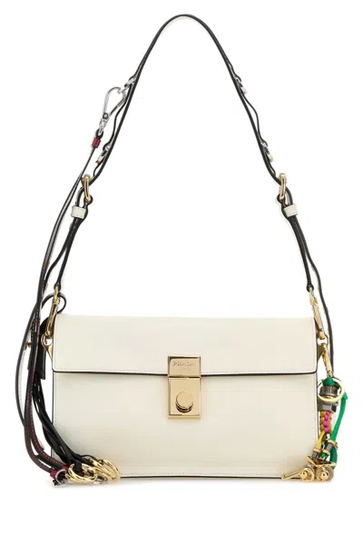 Prada Soft Sound Small Leather Shoulder Bag With Charms In White