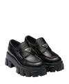 Prada Monolith Lacquered Leather Loafers In Black