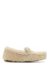Prada Off White Slip On Loafers In Neutral