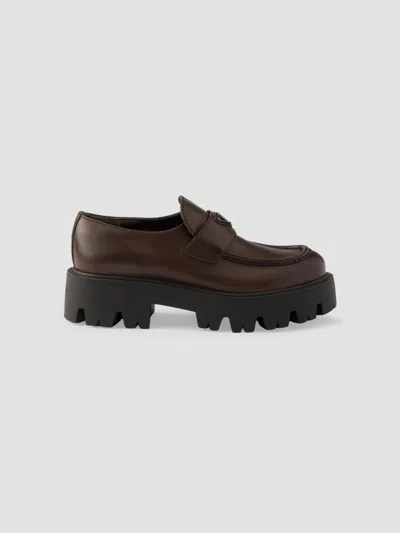 Prada Stride Leather Penny Loafers In Brown