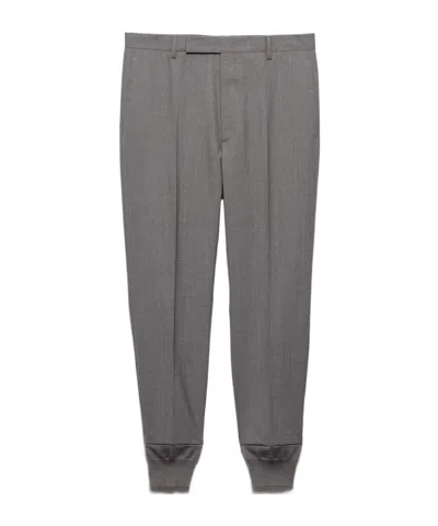 PRADA PRADA TRIANGLE-PATCH TROUSERS