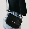 Pretty Simple Serenity Saddle Crossbody Guitar Strap Bag In Black In Black
