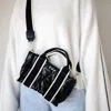 Pretty Simple Women's Mini Quilted Crossbody Bag In Shiny Patent Black In Multi