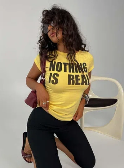 Princess Polly Lower Impact Nothing Is Real Graphic Top