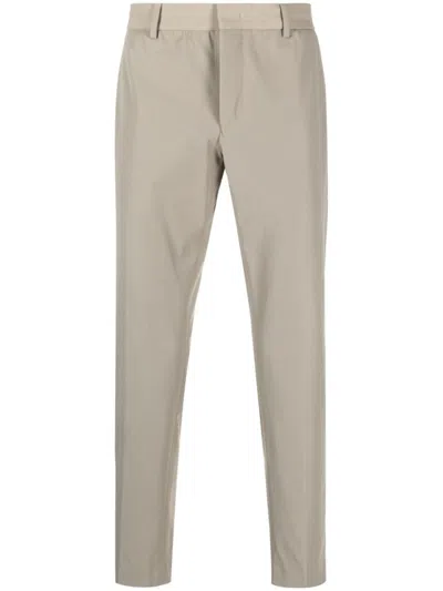 PT TORINO SLIM-FIT TROUSERS WITH SMOOTH FINISH AND DISCREET POCKETS