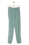 Puma Essentials Piped Tricot Pants In Green Moon
