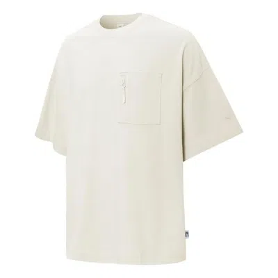 Puma Logo Pocket T-shirt 'beige' In Neutral
