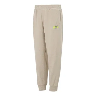 Puma Trend Graphic Logo Pants 'beige' In Neutral
