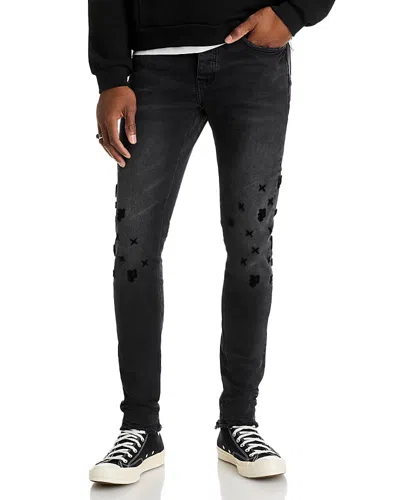 PURPLE BRAND TUFFETAGE MONOGRAM JEANS