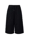 Pushbutton Drawstring Textured Shorts In Black