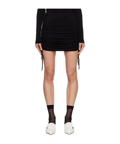 PUSHBUTTON PLEATED MINI SKIRT