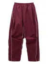 Pushbutton Pleated Piped Track Pants In Burgundy