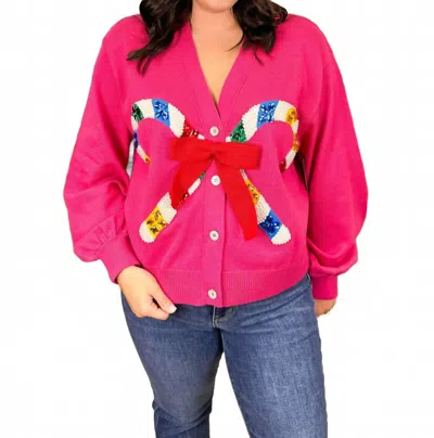 Queen Of Sparkles Candy Cane And Bow Cardigan In Pink