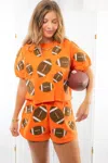 Queen Of Sparkles Fuzzy Football Top In Orange In Orange