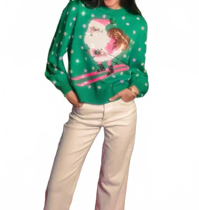 Queen Of Sparkles Santa Skiing Sweater In Green And Neon Pink