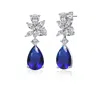 Rachel Glauber White Gold Plated With Colored Cubic Zirconia Teardrop Cluster Earrings In Blue