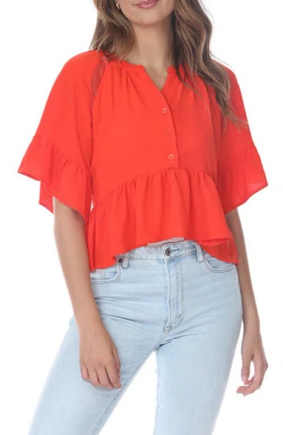 Rain And Rose Eyelet Peplum Top In Orange