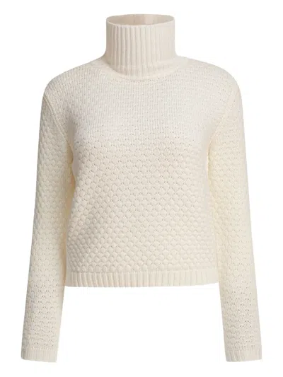 RAKKÌ ROLL-NECK TEXTURED WOOL SWEATER
