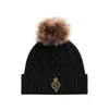 Ralph Lauren Crest-patch Pom-pom Cable-knit Beanie In Black