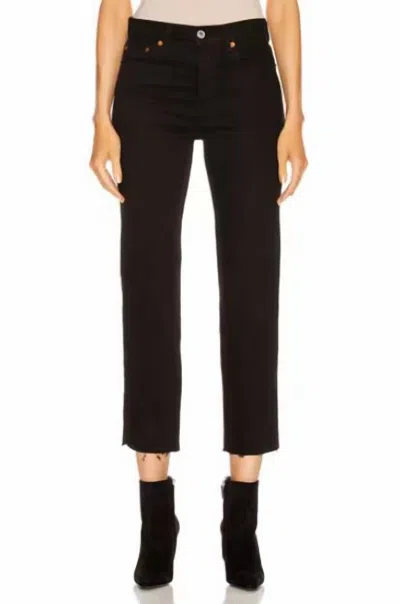 Re/done Originals Stove Pipe High Rise Raw Hem Jeans In Black