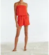 RED HAUTE STRAPLESS SMOCKED ROMPER IN RED