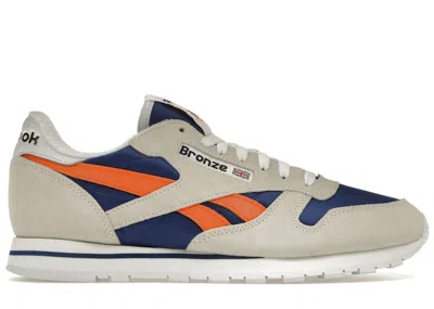 Pre-owned Reebok Men's  Classic Leather Bronze 56k Sneakers In Chalk/classic Cobalt Blue/slam Orange In Multi