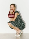 Reformation Mini Monica Frame Handle In Ruby Patent