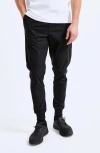 Reigning Champ Stretch Warp Knit Coach's Slim Joggers In Black