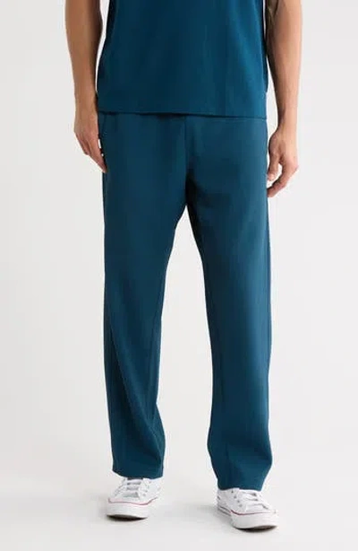 Reigning Champ Double Knit Rally Relaxed Performance Pants In Blue