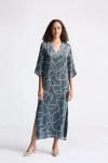 Reistor Maxi Dress With Side Slits In Twirls And Twists