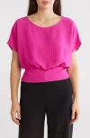Renee C Short Sleeve Smocked Hem Blouson Top In Fuchsia